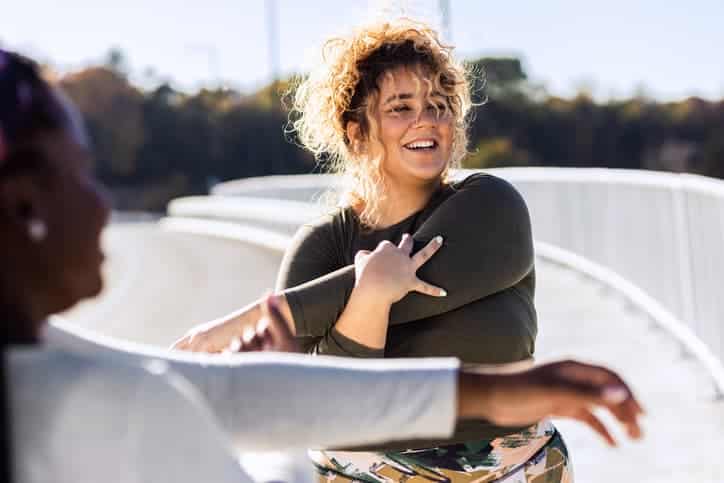 A young lady is exercising in the morning happily.